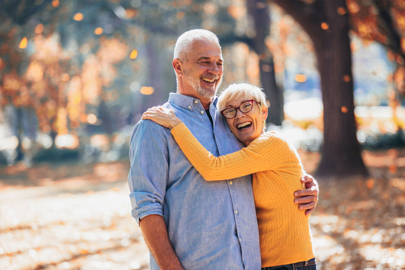 Retired man and woman reviewing their retirement finances